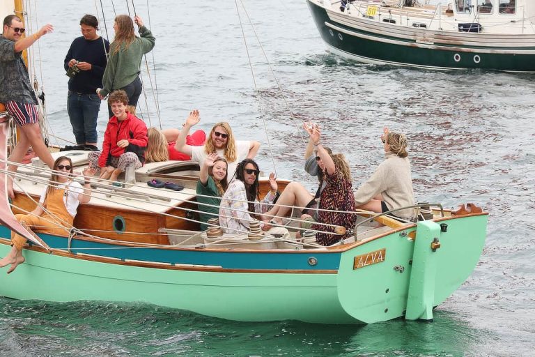 The crew of the gaff cutter Alva enjoying the Falmouth Classics Parade